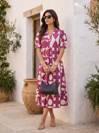 Magenta Cream Bold Geometric Print Collared Puff Sleeve Midi Dress - Full length front walking in Moroccan courtyard