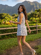 White Navy Block Print Collared Sleeveless Mini Dress - Adjusting collar at fence
