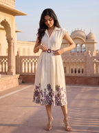 Ivory Mughal Floral Border Belted Midi Dress - Walking side profile with tote